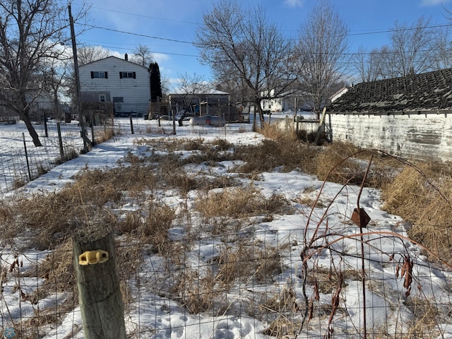 view of yard layered in snow