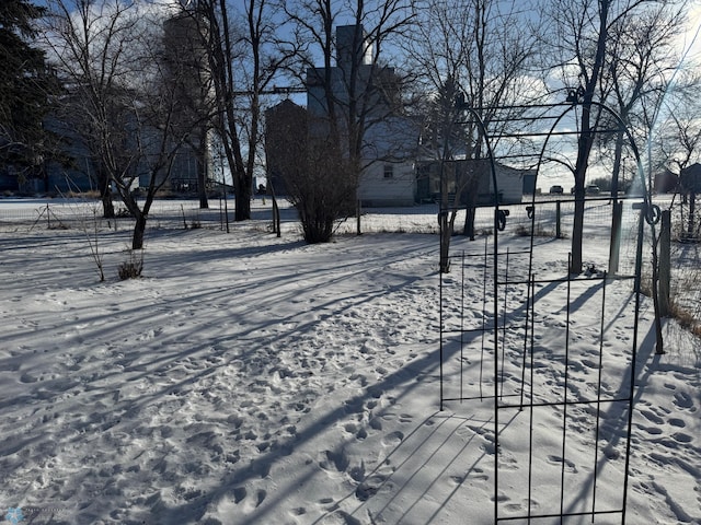 view of yard layered in snow