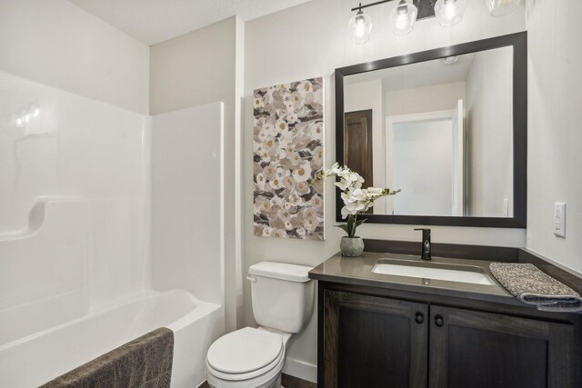 full bathroom featuring shower / tub combination, vanity, and toilet