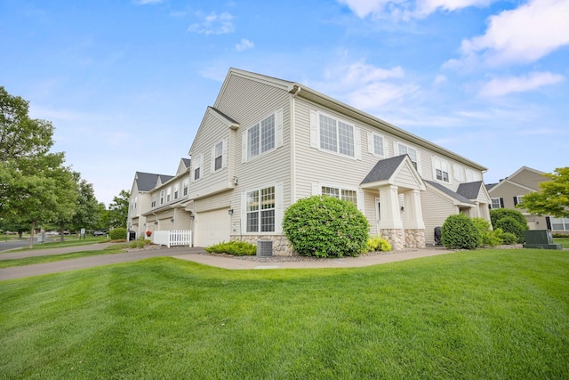 13905 52nd Ave N Unit 701, Plymouth, MN 55446 - view of front of property with stone siding, driveway, a front lawn, and a garage