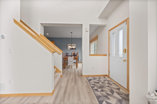 13905 52nd Ave N Unit 701, Plymouth, MN 55446 - entrance foyer featuring stairs, wood finished floors, and a chandelier