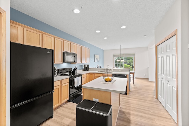 13905 52nd Ave N Unit 701, Plymouth, MN 55446 - kitchen with black appliances, light brown cabinets, a peninsula, light wood-style flooring, and recessed lighting