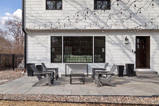 view of patio / terrace with entry steps and fence