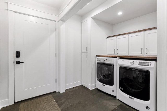 laundry area featuring cabinet space, washer and dryer, and recessed lighting