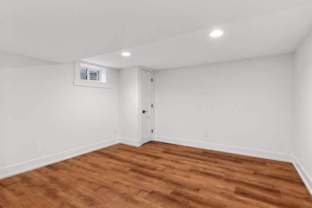 interior space with recessed lighting, wood finished floors, and baseboards