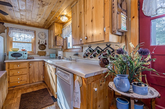 kitchen with light countertops, wooden ceiling, a sink, light wood-style floors, and white dishwasher