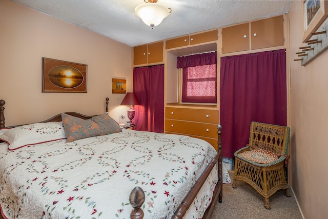bedroom with light carpet, a closet, and a textured ceiling