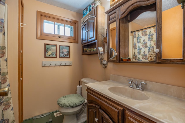 full bath with a shower with shower curtain, toilet, and vanity