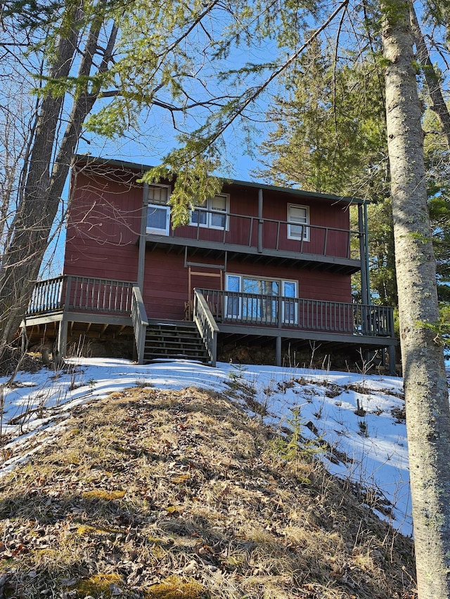 view of front facade with a wooden deck