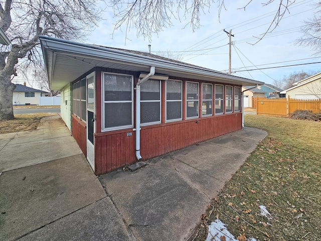 view of property exterior featuring a lawn