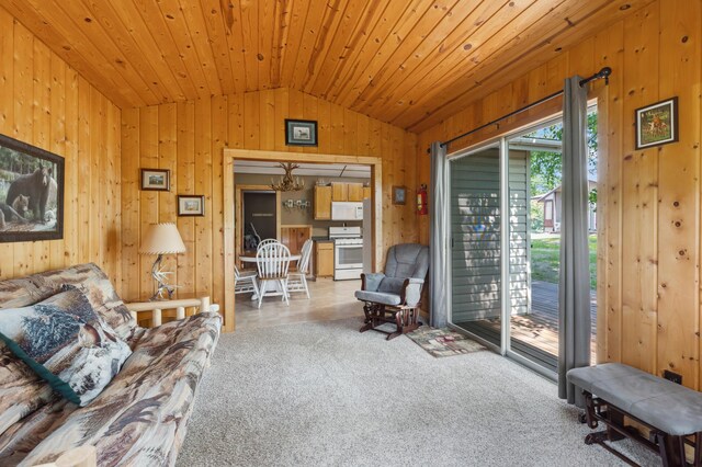 1378 Larrup Trl SW, Pine River, MN 56474 - carpeted living area featuring lofted ceiling, wooden walls, a chandelier, and wooden ceiling