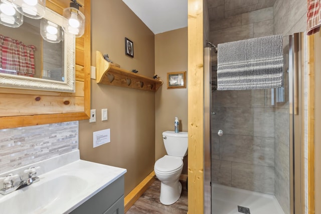 1378 Larrup Trl SW, Pine River, MN 56474 - bathroom with a shower stall, vanity, toilet, decorative backsplash, and baseboards