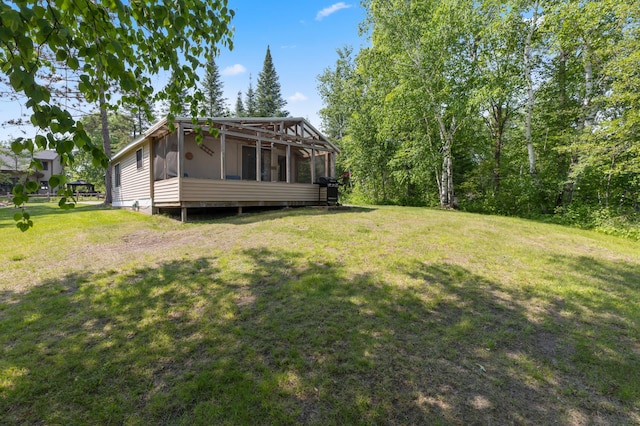 1378 Larrup Trl SW, Pine River, MN 56474 - view of grassy yard featuring a sunroom