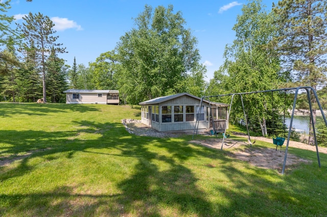 1378 Larrup Trl SW, Pine River, MN 56474 - view of green lawn featuring a sunroom and a water view