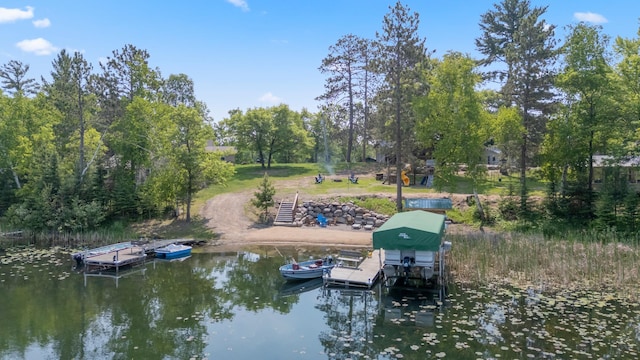 1378 Larrup Trl SW, Pine River, MN 56474 - dock area with a water view, boat lift, and view of wooded area