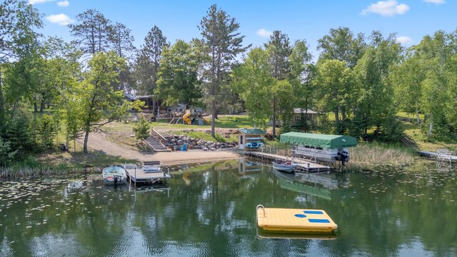 1378 Larrup Trl SW, Pine River, MN 56474 - dock area with a water view, view of wooded area, and stairs