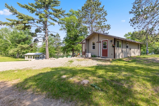 1378 Larrup Trl SW, Pine River, MN 56474 - view of home's exterior featuring a lawn and central air condition unit