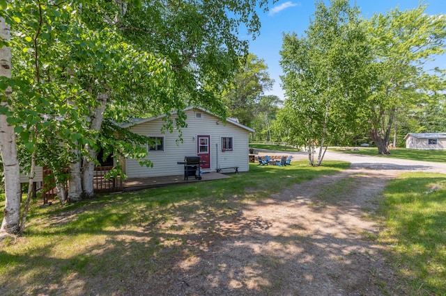 1378 Larrup Trl SW, Pine River, MN 56474 - view of side of home featuring a lawn and driveway