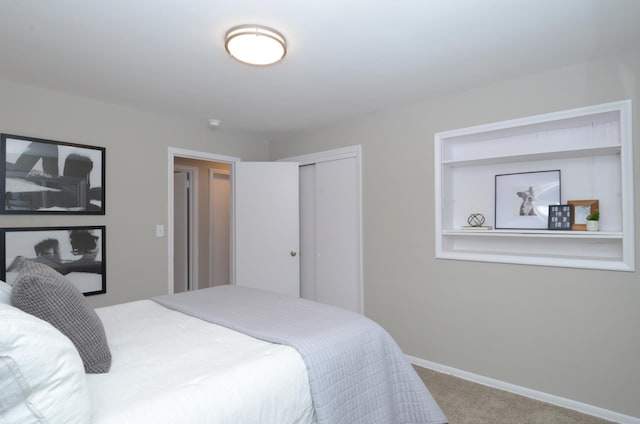 carpeted bedroom featuring a closet