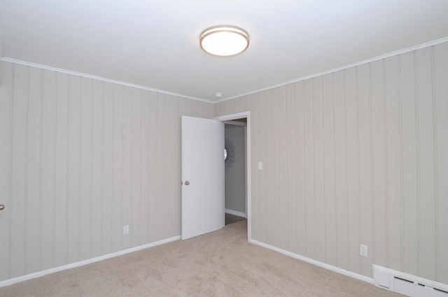 unfurnished room featuring crown molding and light colored carpet