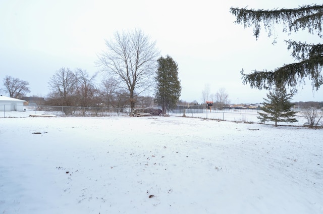 view of yard layered in snow