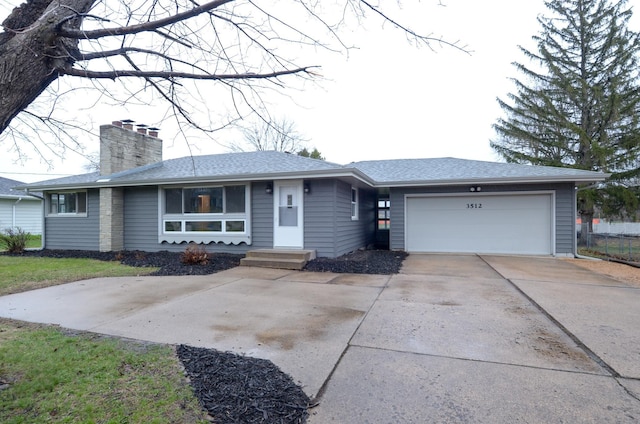 single story home featuring a chimney, roof with shingles, concrete driveway, and an attached garage