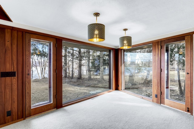 unfurnished sunroom featuring a wealth of natural light