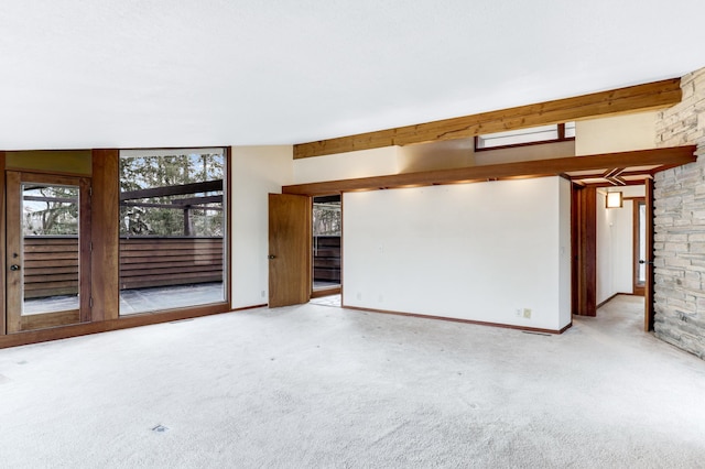 carpeted spare room with baseboards