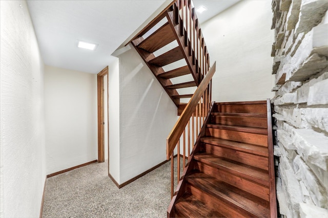 stairway with carpet and baseboards