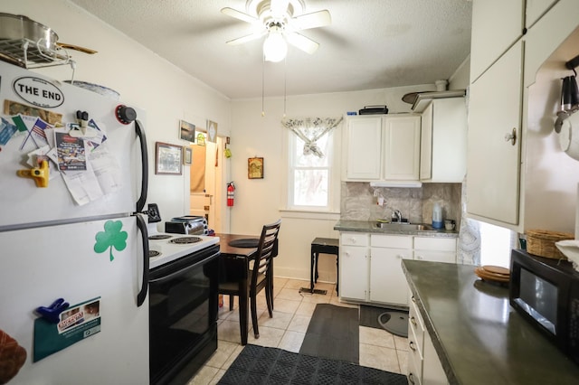 kitchen featuring light tile patterned floors, ceiling fan, white cabinetry, electric range oven, and white refrigerator