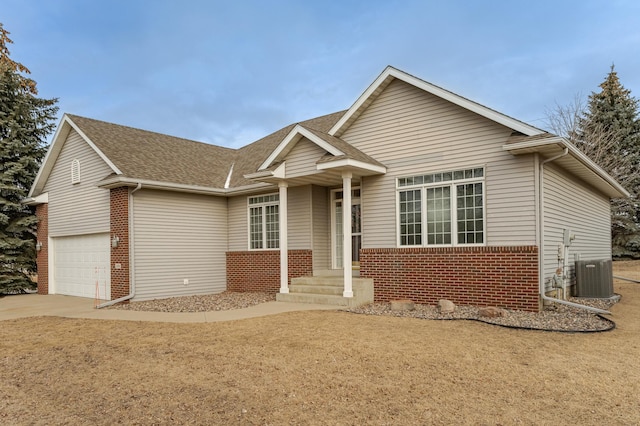 view of front of house featuring central AC and a front lawn