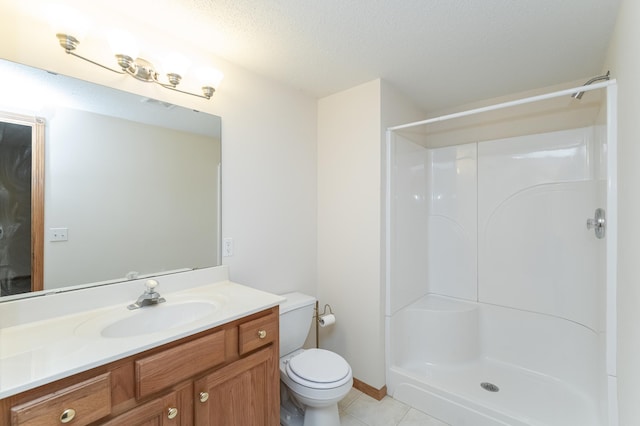 bathroom featuring a shower, tile patterned flooring, toilet, a textured ceiling, and vanity