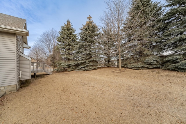 view of yard with a wooden deck