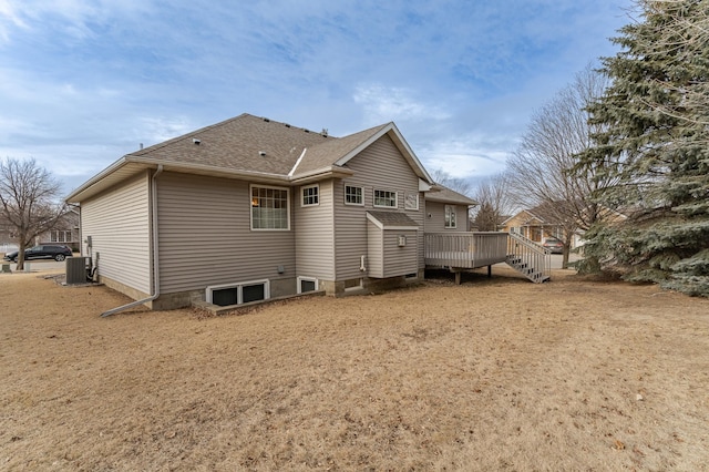 rear view of property featuring central AC and a deck