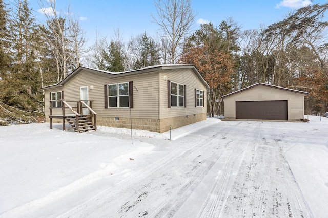 view of front of home featuring a garage and an outdoor structure