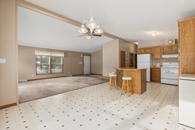 kitchen with ceiling fan with notable chandelier, lofted ceiling, a kitchen bar, light carpet, and white appliances