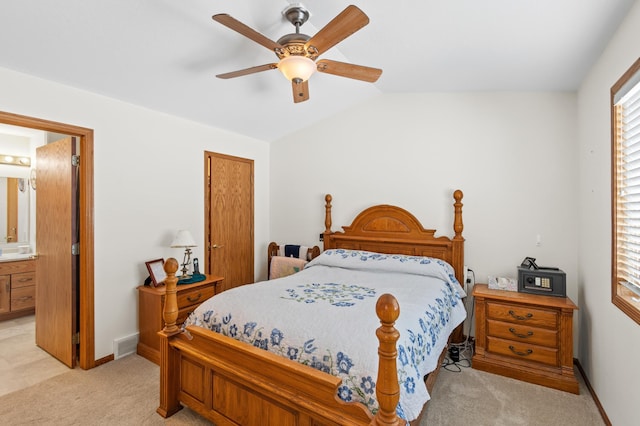 bedroom with visible vents, baseboards, light colored carpet, lofted ceiling, and a ceiling fan