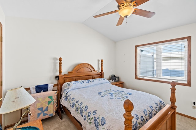 bedroom with light carpet, ceiling fan, baseboards, and vaulted ceiling