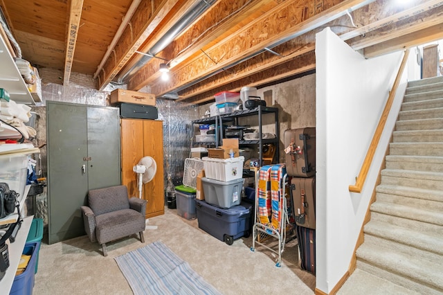 unfinished basement featuring stairs