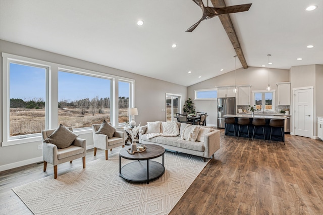 living room featuring ceiling fan, beam ceiling, high vaulted ceiling, and light wood-type flooring