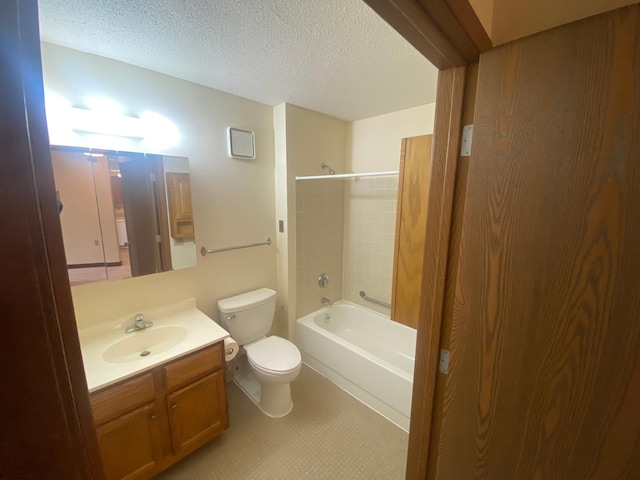 full bathroom with vanity, toilet, shower / bathtub combination, and a textured ceiling