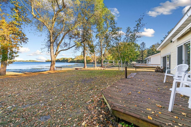 view of yard featuring a deck with water view