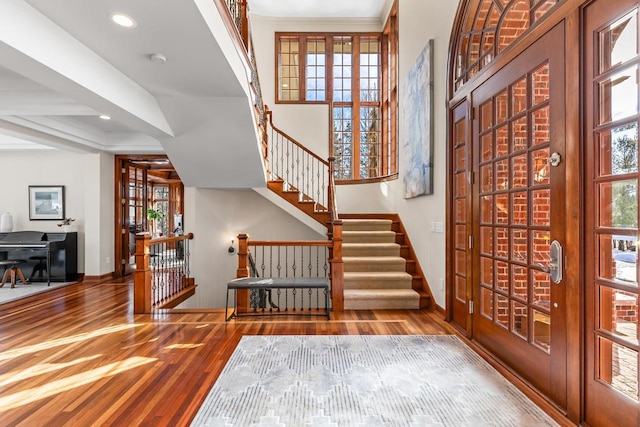 interior space with recessed lighting, stairway, baseboards, and wood finished floors