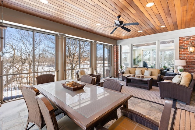 sunroom / solarium with wooden ceiling and a ceiling fan