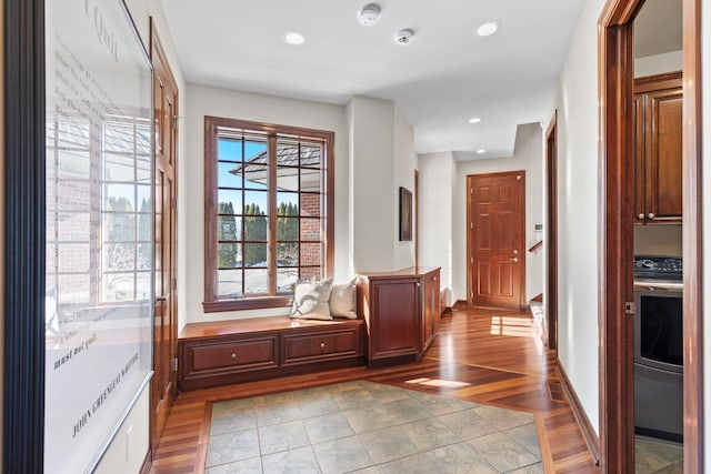 doorway to outside featuring baseboards, recessed lighting, visible vents, and light wood-style floors