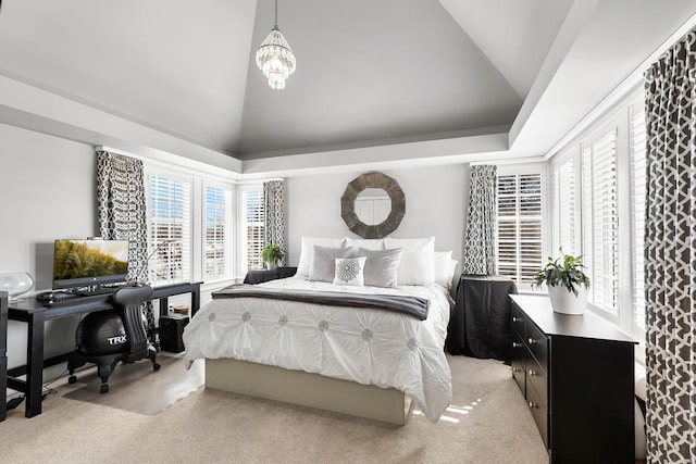 bedroom featuring a notable chandelier, high vaulted ceiling, and light colored carpet