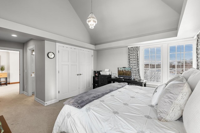 bedroom featuring baseboards, light colored carpet, a notable chandelier, vaulted ceiling, and a closet