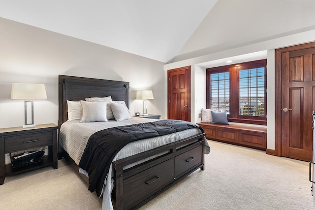 bedroom featuring high vaulted ceiling and light colored carpet