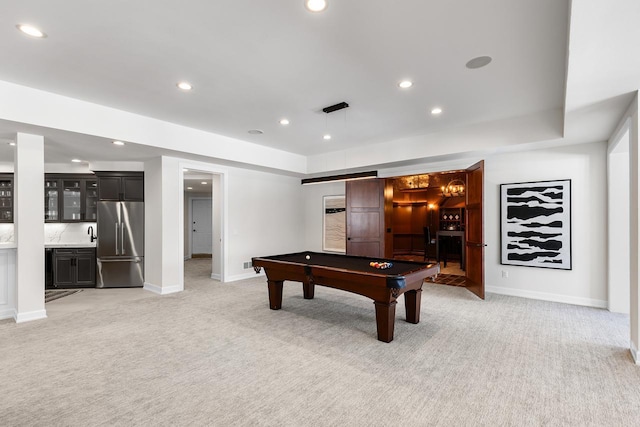 playroom featuring light carpet, wet bar, and recessed lighting