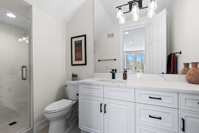 full bathroom with a stall shower, visible vents, toilet, vaulted ceiling, and vanity